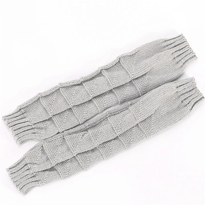 Detailed view of gray knit arm warmers with waffle texture and ribbed cuffs for winter
