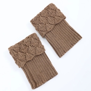 Detail of brown knit boot cuffs showing diamond pattern and ribbed texture socks
