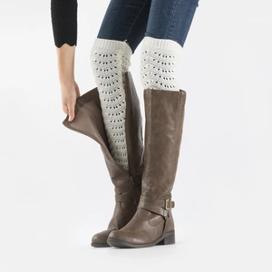 Detail of white crochet knit boot cuffs with hollow out wave pattern and ribbed top trim