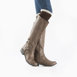 Detail of dark brown cable knit leg warmers with white lace trim on tall leather boots