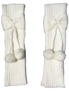 Detailed knit texture of white leg warmers featuring cute ribbon bows and soft pom-poms