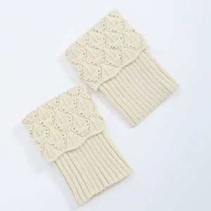 Detailed close-up of knit leg warmer with scallop edge and diamond pattern