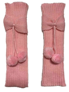 Detail of pink knitted leg warmers with ribbon bow and soft pompom accents