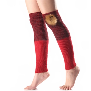 Winter knitted leg warmers with bicolor pattern and detachable faux fur pom-poms