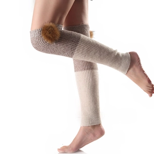 Knee-high bicolor knitted leg warmers with faux fur balls in beige and light coffee