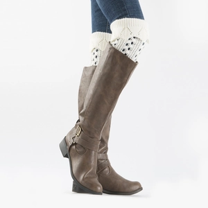 Detail view of cream crochet lace boot cuffs with hollow knit patterns and ribbed top