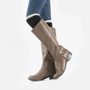 Close-up of brown matte knee-high boots featuring lace leg warmer and metal buckles