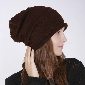 Detail of ribbed knit texture on coffee brown slouchy beanie with soft woven pattern