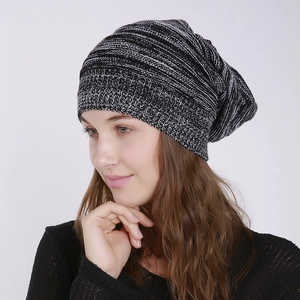 Detail of the black and white mixed knit texture on a slouchy winter beanie hat