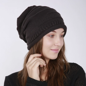 Detailed close-up of dark brown ribbed knit beanie texture and slouchy winter hat design