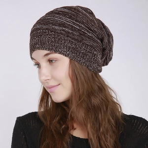 Detail of mixed brown and white knit texture on a slouchy winter beanie cap