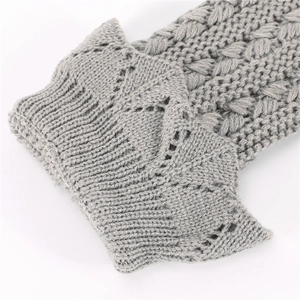 Grey knit leg warmer with cable pattern and hollow-out crochet lace trim details