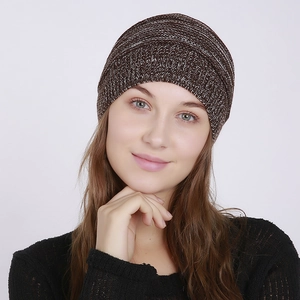 Macro detail of the brown knit beanie showing soft mixed-yarn texture and stitching