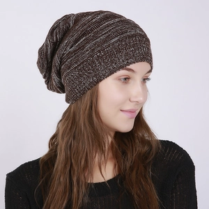 Detail of slouchy beanie showing dark brown mixed knit texture and ribbed elastic cuff