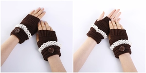 Close-up of knit fingerless gloves with white lace trim and decorative button detail