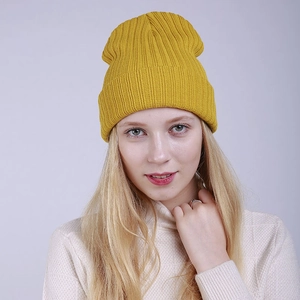 Ginger yellow ribbed knit beanie for men and women showing warm winter style