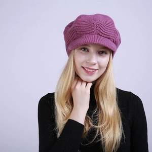 Close-up of purple cable knit newsboy hat with fleece lining and soft wavy texture