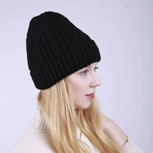Detail view of the black cable knit pattern and cuff on this winter thermal beanie