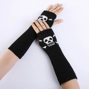 Detail of the knitted skull pattern and ribbed texture on the black fingerless arm warmer