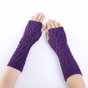 Detailed knit texture of dark purple fingerless arm warmers with hollow diamond pattern