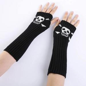 Detail of black knit fingerless gloves with white skull and crossbones punk design