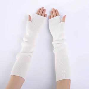 Detailed knit texture of cream white cashmere fingerless long gloves for winter arm warming