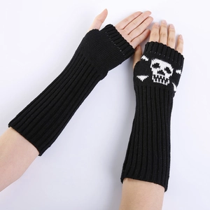 Close-up of black ribbed knit arm warmers with gothic skull and crossbones design