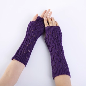 Close-up of purple knit fingerless arm warmers with hollow leaf and cable patterns