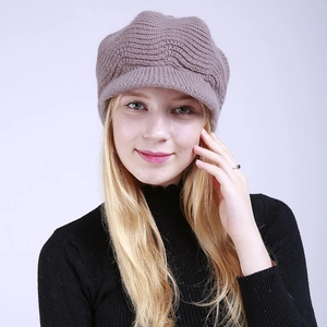 Detailed wave knit texture of women's thermal newsboy hat with warm fleece lining