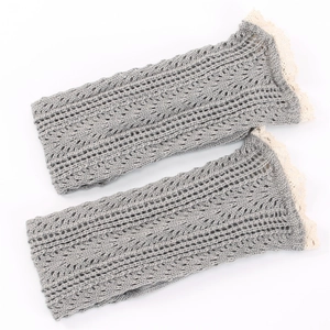 Grey knitted leg warmers with mesh hollow pattern and cream lace trim finish