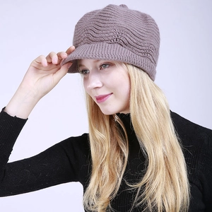 Detail showing the thick 3D wave knit texture and matching brim of the purple peaked beanie
