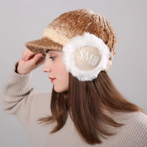 Detailed side view of gradient knit hat with plush ear flaps and SMB embroidery