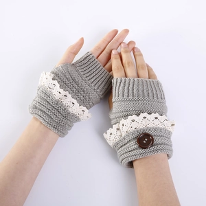 Women's autumn grey knit fingerless gloves with elegant white lace trim and button detail