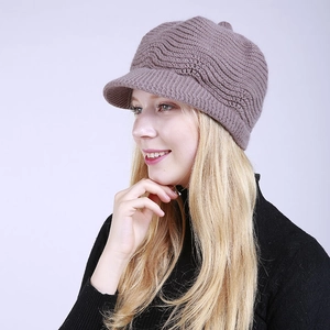 Close-up of the thick knitted texture and ribbed brim of this warm winter beret hat