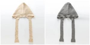 Detail of soft ribbed knit balaclava hat in beige and grey with long straps