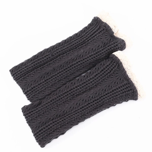 Dark gray knitted leg warmers with cream lace trim and ribbed hollow mesh texture