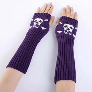 Detailed knit texture of purple arm warmers with white skull and crossbones design