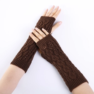 Detailed view of dark brown knitted arm warmer with vintage cable knit and leaf pattern