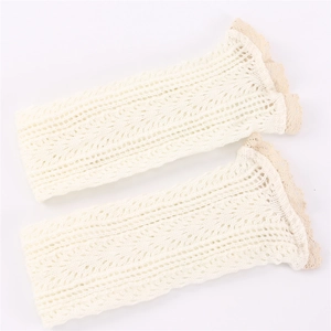 White knit leg warmers with hollow mesh pattern and delicate lace trim edges