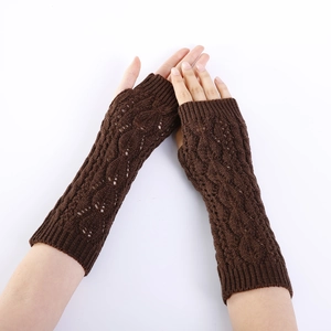 Detail of dark brown cable knit long fingerless gloves with hollow leaf pattern