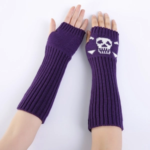 Detail of purple knitted fingerless gloves with white skull and crossbones motif