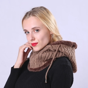 Detail of winter knitted hood with thick cable stitch and warm plush faux fur lining
