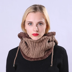 Detailed view of brown cable knit neck warmer with thick faux fur lining and drawstring