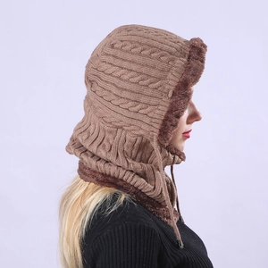 Detail of cable knit winter hood showing thick faux fur lining and drawstring tie