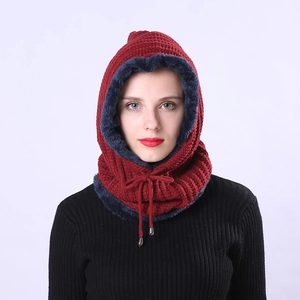Detail of burgundy knitted hood with blue faux fur lining and adjustable drawstring cord