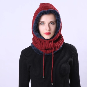 Detail of red cable knit hooded scarf with thick navy faux fur lining and drawstring