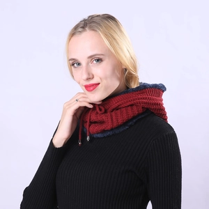 Detail of burgundy knit neck warmer with blue plush lining and adjustable drawstrings