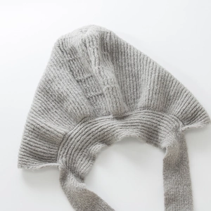 Gray chunky knit earflap beanie with long ties for winter warmth and retro style