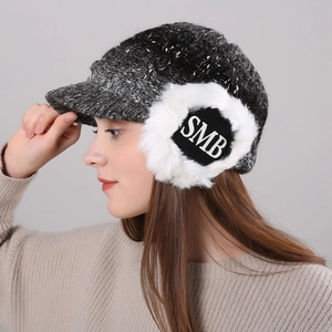 Women's winter knit peaked cap with fuzzy earflaps featuring SMB logo and brim