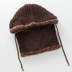 Detailed close-up of dark brown cable knit beanie with warm thick fleece lining and drawstrings